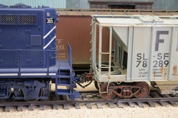 The conductor has diligently laced up the air hoses for the subsequent brake test