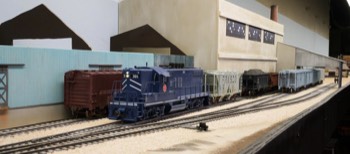 GP9 switching at Peerless White Lime Co. in Mosher.  Note that a recent tornado has demolished both roofs - the company has roofing crews on the wa