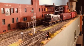 Switcher passing Great Western Stove at the end of L&T trackage